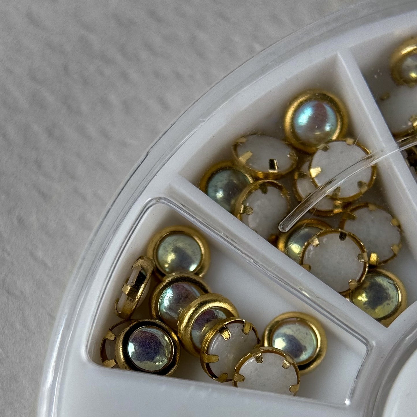 Nail pearls with gold edging